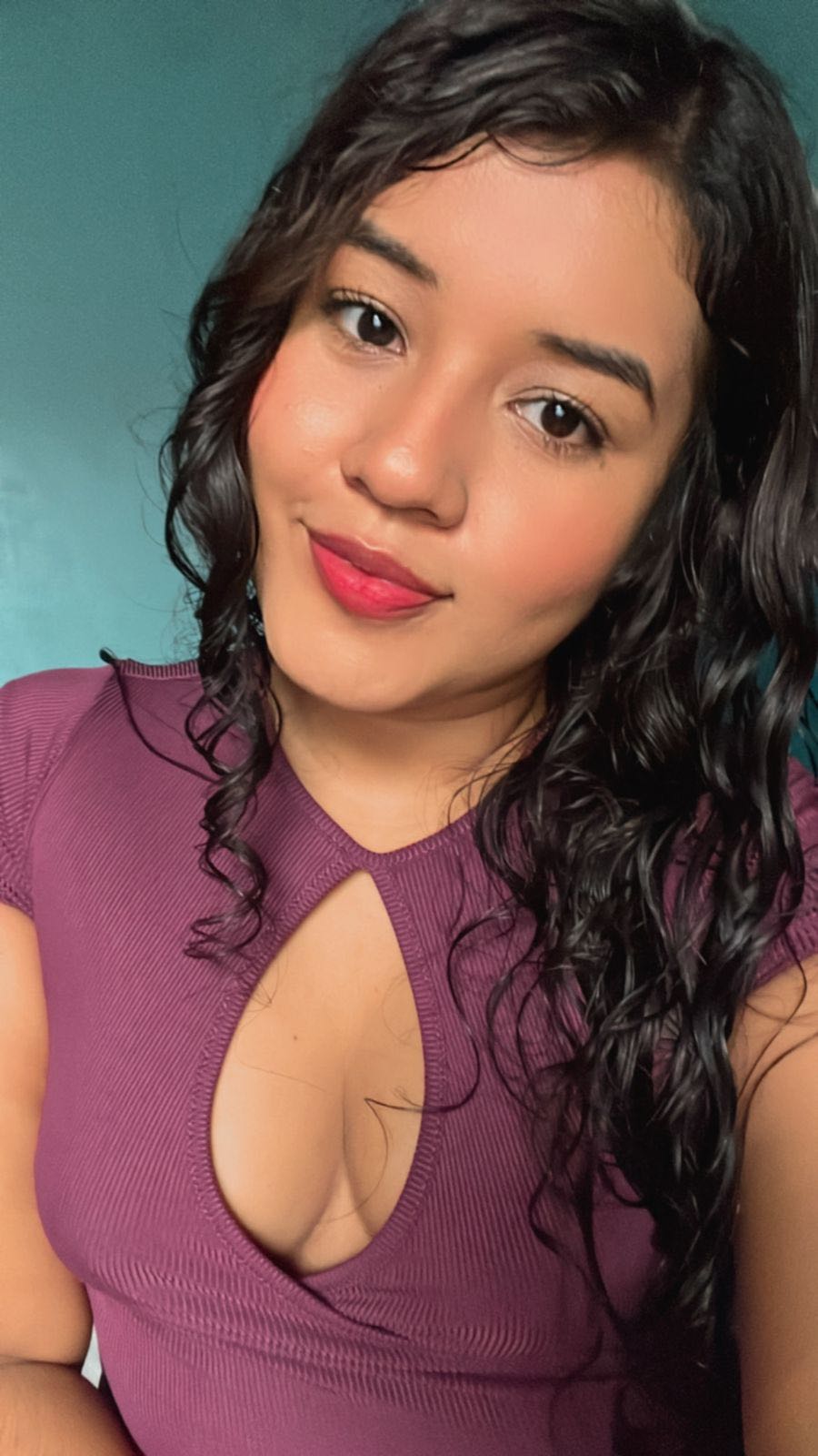 A girl with curly hair face to face on a video call
