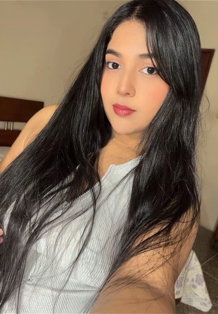 A girl with long black hair in a white top